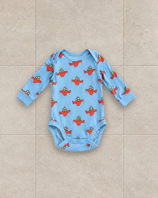 Body à motif d'avions sur fond carrelage