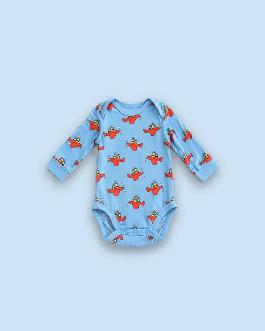 Body à motif d'avions sur fond fond uni bleu ciel